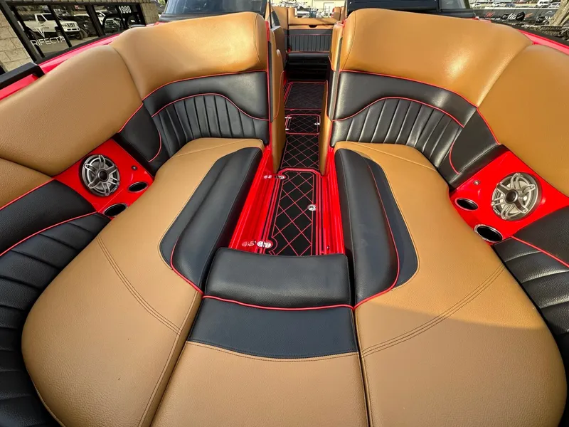 Slide: The Image of The image shows the luxurious interior of a 2023 MB SPORTS B52 boat with elegant seating. - 26
