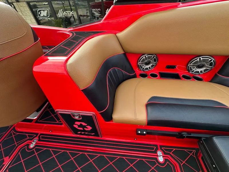 Slide: The Image of The image shows the interior of a 2023 MB SPORTS B52 with red and brown seating. - 19