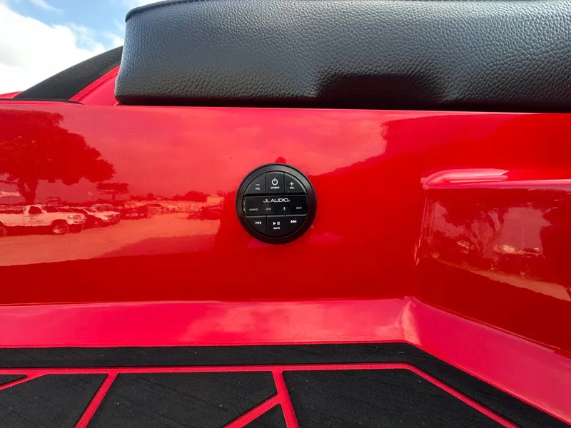 Slide: The Image of Close-up of a red boat deck with a JL Audio volume control. - 41