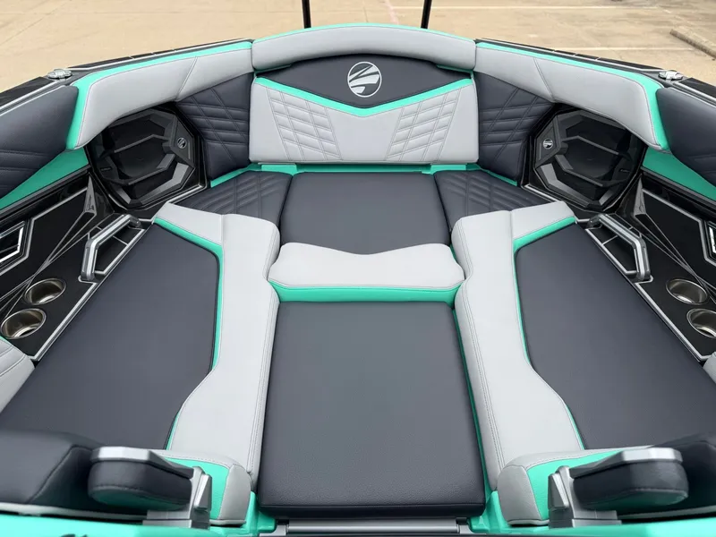 Slide: The Image of The image shows the luxurious interior of a Tigé Ultré 23ZX boat with stylish seating. - 18