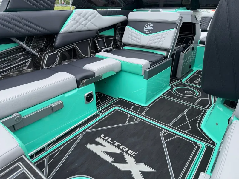 Slide: The Image of The interior of a 2025 Tigé Ultré 23ZX with stylish seating and modern design. - 11