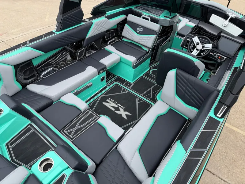 Slide: The Image of The interior of a 2025 Tigé Ultré 23ZX with modern seating and stylish design. - 8