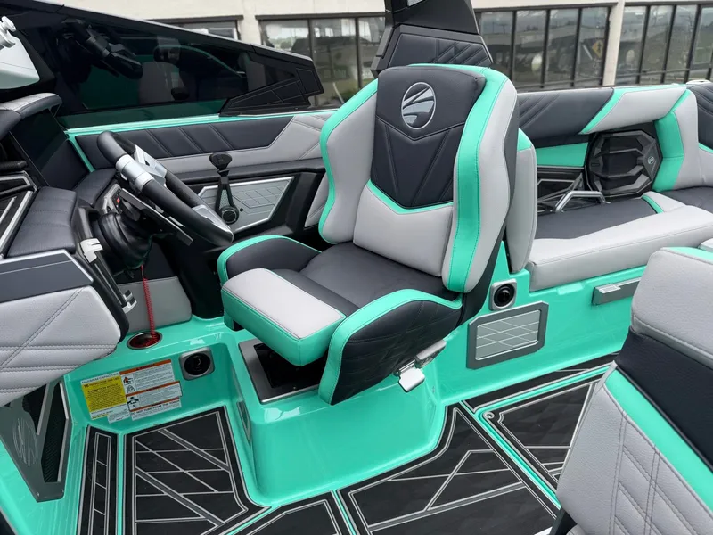 Slide: The Image of The image shows the interior of a 2025 Tigé Ultré 23ZX boat with modern seating. - 15
