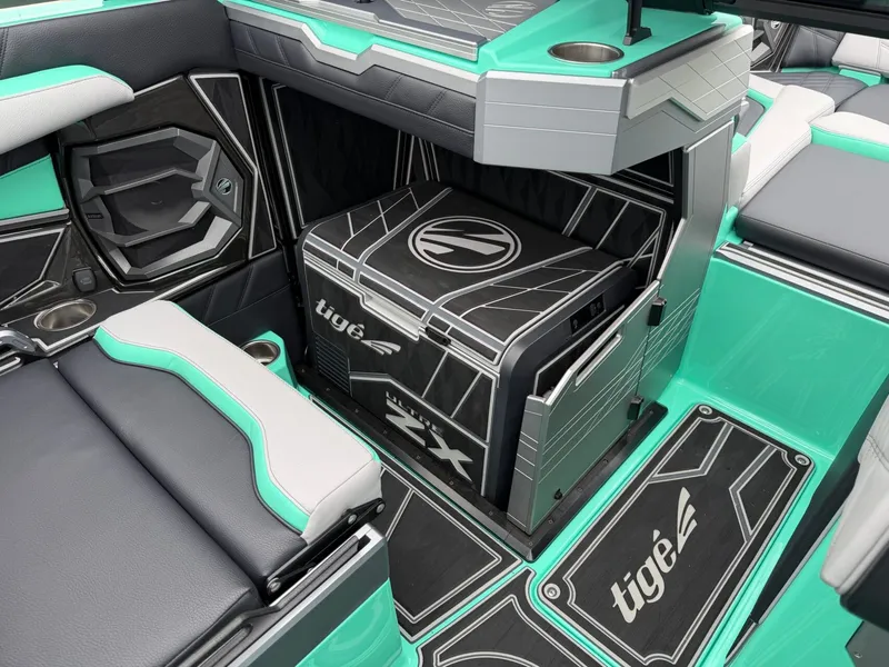 Slide: The Image of The image shows the stylish interior of a Tigé Ultré 23ZX boat with modern seating and accents. - 17