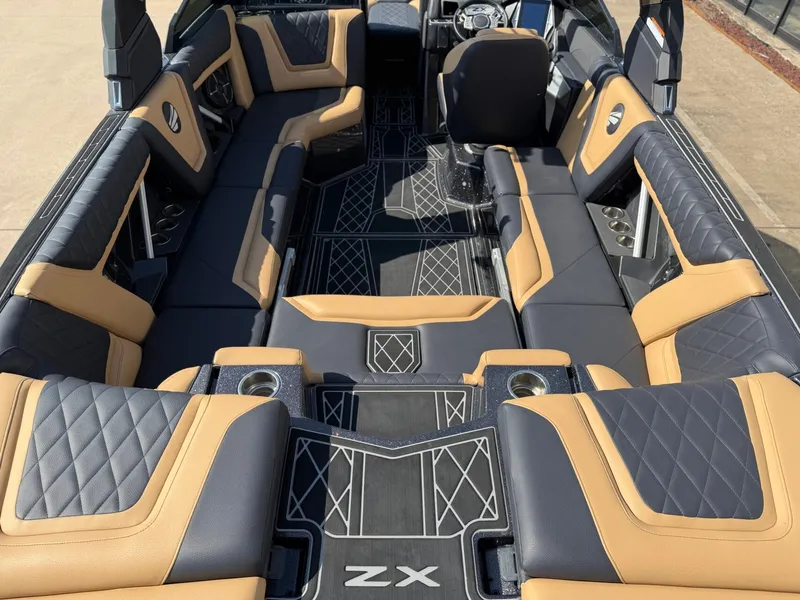 Slide: The Image of The image shows the luxurious interior of a 2022 Tigé 25ZX boat with sleek seating. - 9