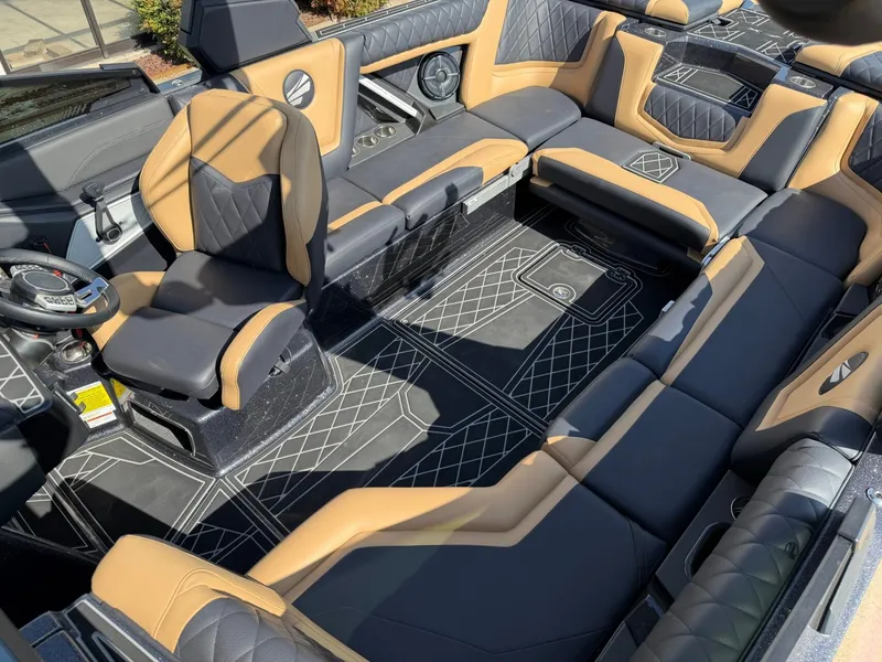 Slide: The Image of The image shows the luxurious interior of a Tigé 25ZX boat with elegant seating and modern design. - 20