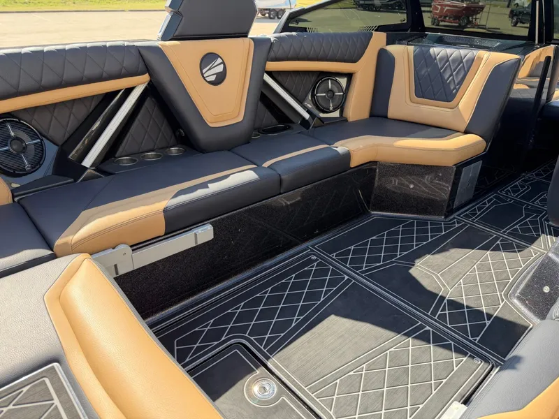 Slide: The Image of The image shows the luxurious interior of a Tigé 25ZX boat with sleek seating and modern details. - 13