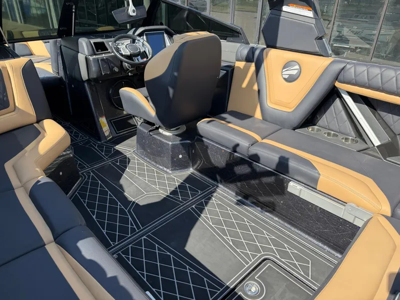 Slide: The Image of The image shows the cockpit of a 2022 Tigé 25ZX with luxurious seating and modern design. - 14