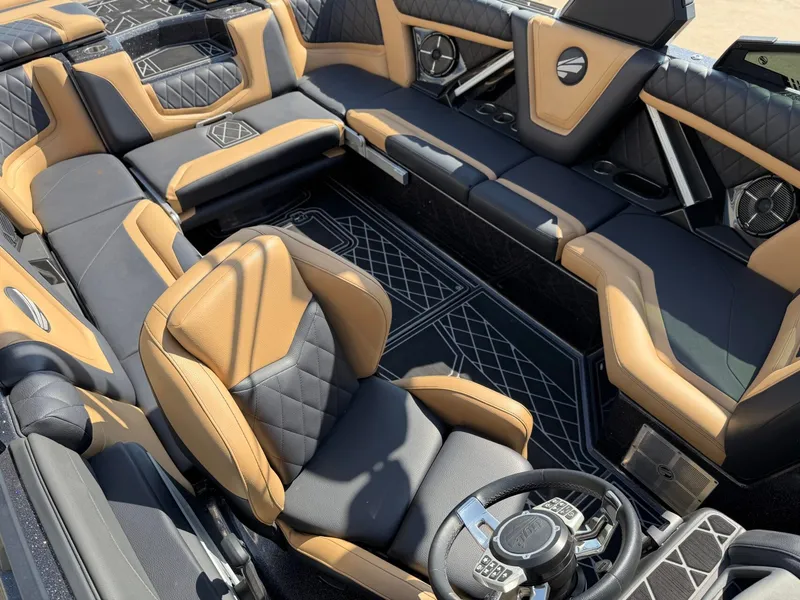 Slide: The Image of The image shows the luxurious interior of a 2022 Tigé 25ZX boat with sleek seating. - 21