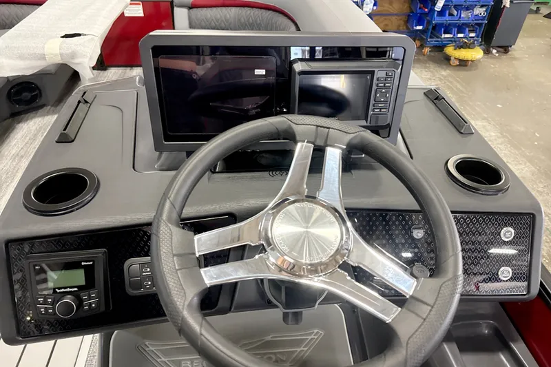 Slide: The Image of Steering console of 2027 Bennington 22 M Open Fastback Quad Bench with modern controls. - 16