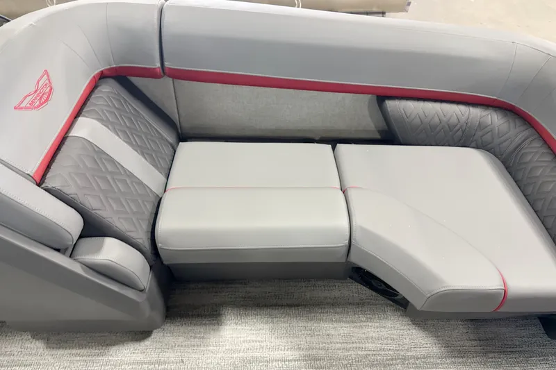 Slide: The Image of Luxurious seating on the 2027 Bennington 22 M Open Fastback Quad Bench, featuring elegant gray upholstery. - 13