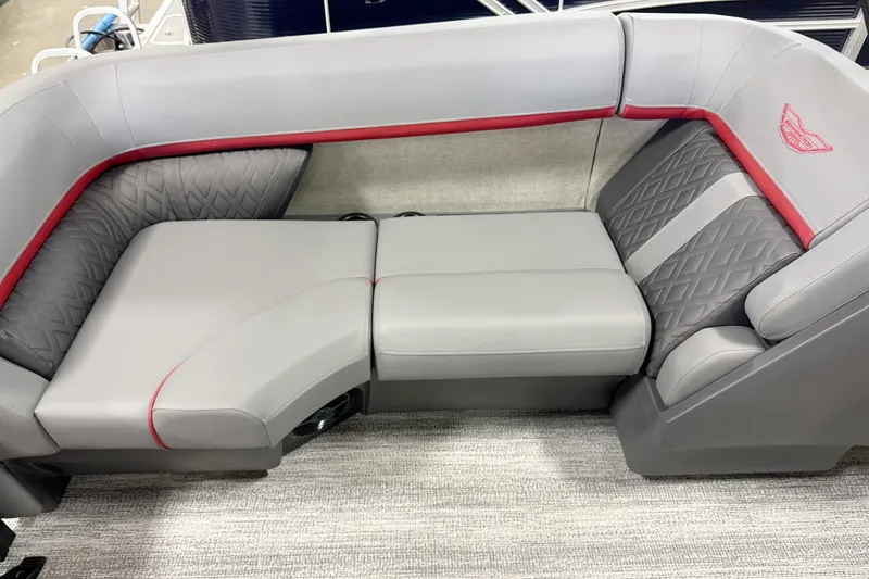 Slide: The Image of Luxurious seating on the 2027 Bennington 22 M Open Fastback Quad Bench, featuring elegant gray upholstery. - 12
