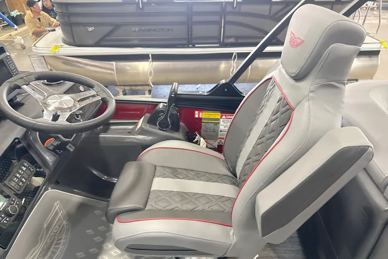 Slide: The Image of Captain's seat and helm of 2027 Bennington 22 M Open Fastback Quad Bench boat. - 15
