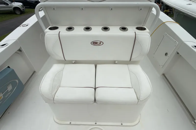 Slide: The Image of 2019 Sea Hunt Gamefish 27 boat seating with rod holders and storage. - 33