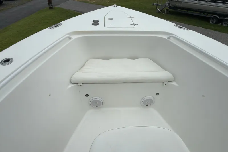 Slide: The Image of 2019 Sea Hunt Gamefish 27 boat interior with cushioned seating and storage. - 14