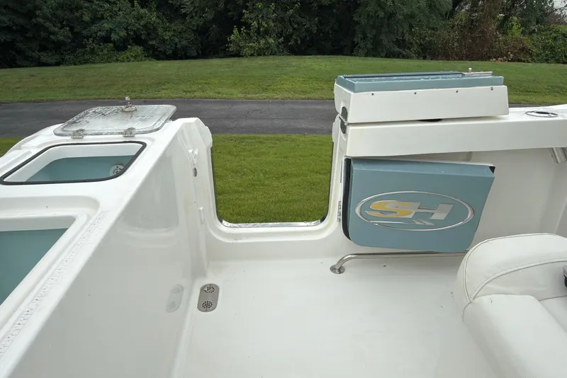 Slide: The Image of 2019 Sea Hunt Gamefish 27 boat interior with storage compartments and seating. - 29