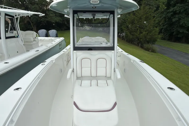 Slide: The Image of 2019 Sea Hunt Gamefish 27 boat interior with seating, showcasing sleek design and spacious layout. - 15