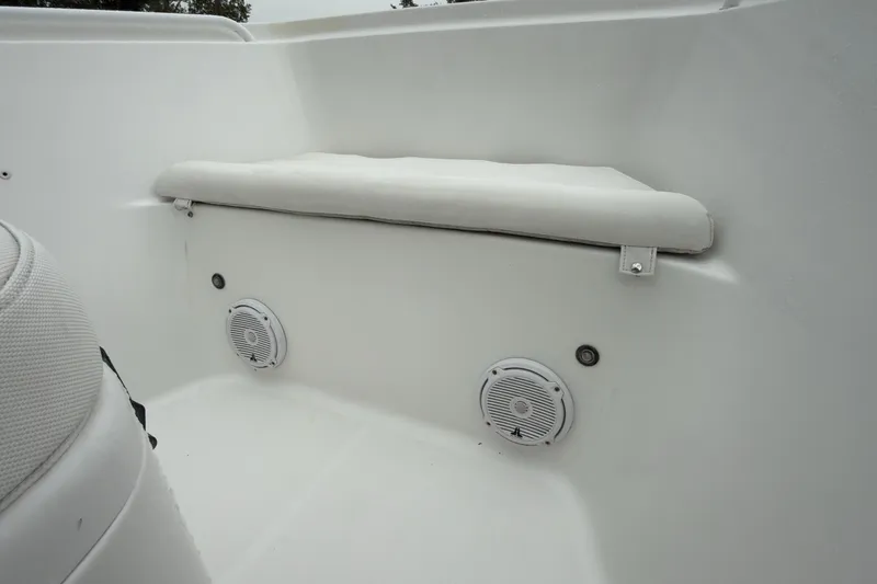 Slide: The Image of 2019 Sea Hunt Gamefish 27 interior with cushioned seating and built-in speakers. - 12