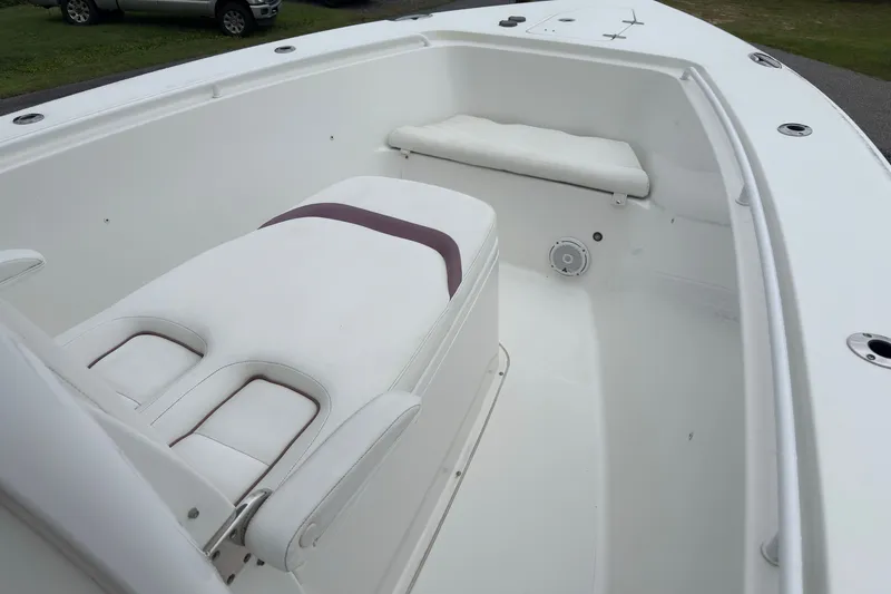 Slide: The Image of 2019 Sea Hunt Gamefish 27 boat interior with white seating and spacious deck. - 11