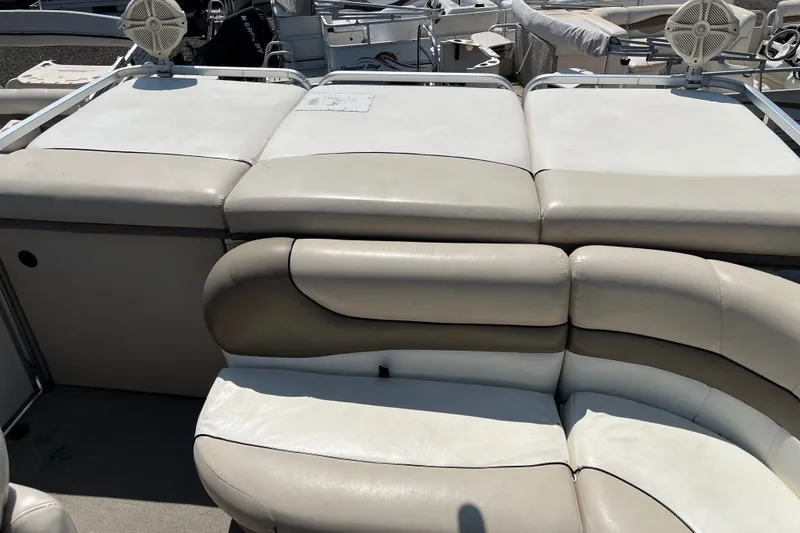 Slide: The Image of Sun Tracker Party Barge 22 I/O Regency Edition 2000, featuring beige seating and deck area. - 8