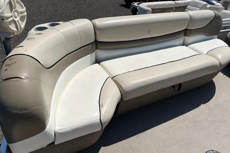 Slide: The Image of 2000 Sun Tracker Party Barge 22 I/O Regency Edition boat seating, beige and white upholstery. - 4