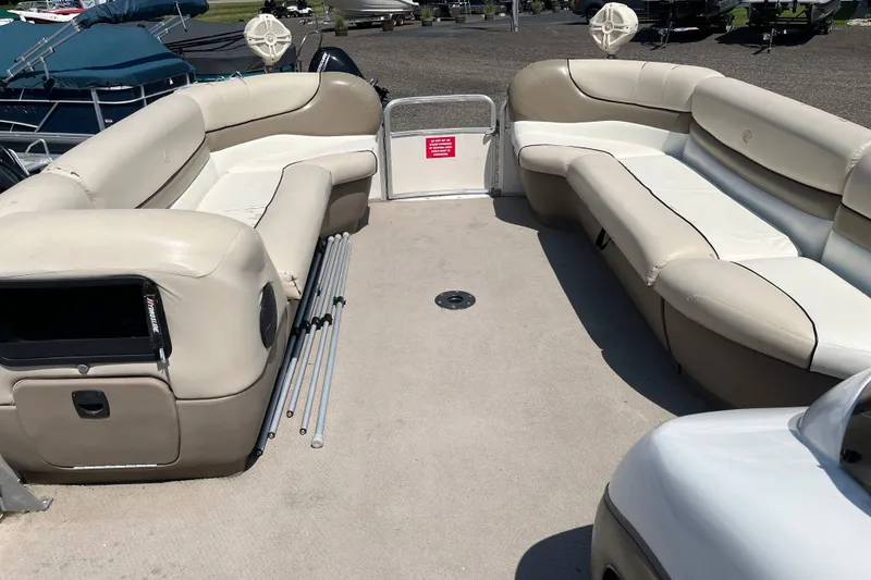 Slide: The Image of 2000 Sun Tracker Party Barge 22 I/O Regency Edition with spacious seating and beige upholstery. - 12