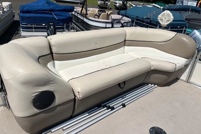 Slide: The Image of 2000 Sun Tracker Party Barge 22 I/O Regency Edition with beige seating and speaker. - 5