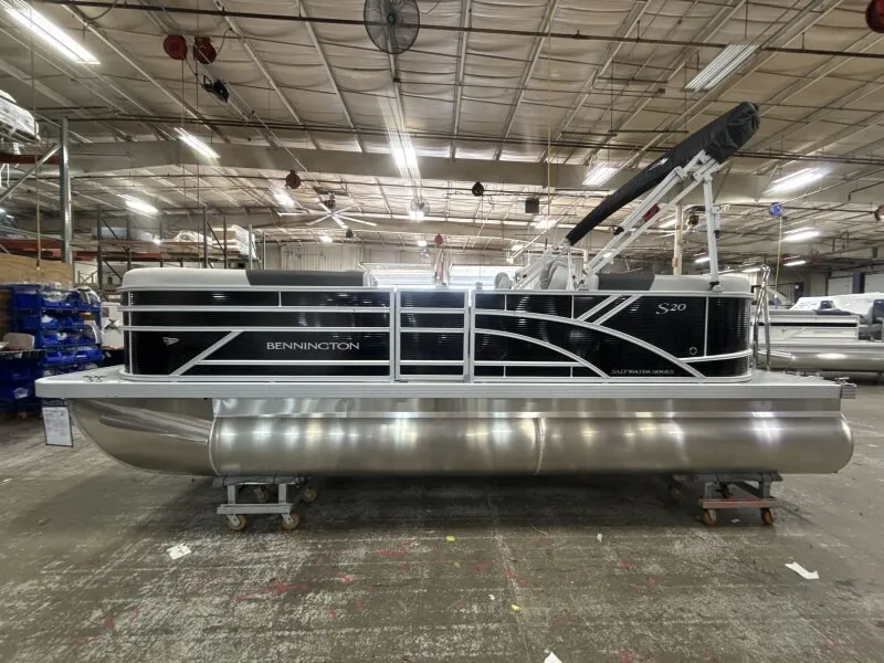 Slide: The Image of A Bennington pontoon boat, model 20 S1 STERN RADIUS, year 2027, is in a warehouse. - 6