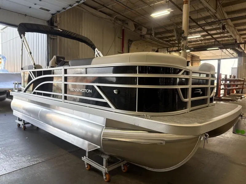 Slide: The Image of 2027 Bennington 20 S1 STERN RADIUS pontoon boat in a warehouse setting. - 6