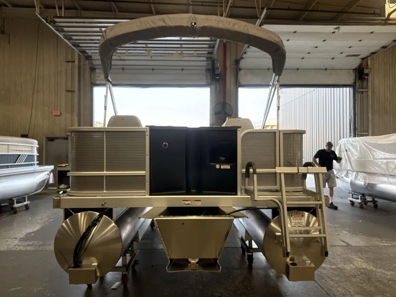 Slide: The Image of 2027 Bennington 20 S1 4 PT FISHING pontoon boat in a warehouse. - 3