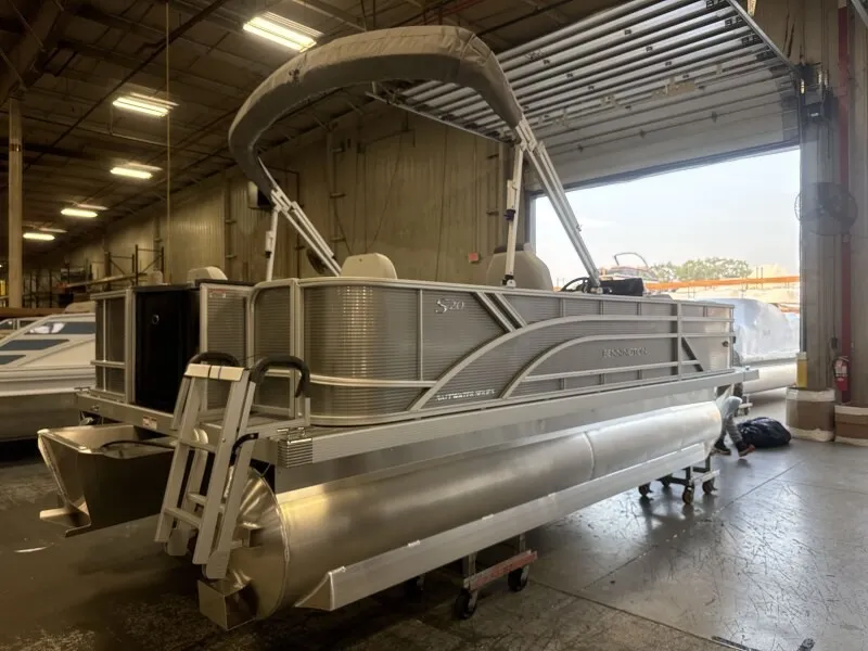 Slide: The Image of Bennington 20 S1 4 PT FISHING pontoon boat in a warehouse. - 3