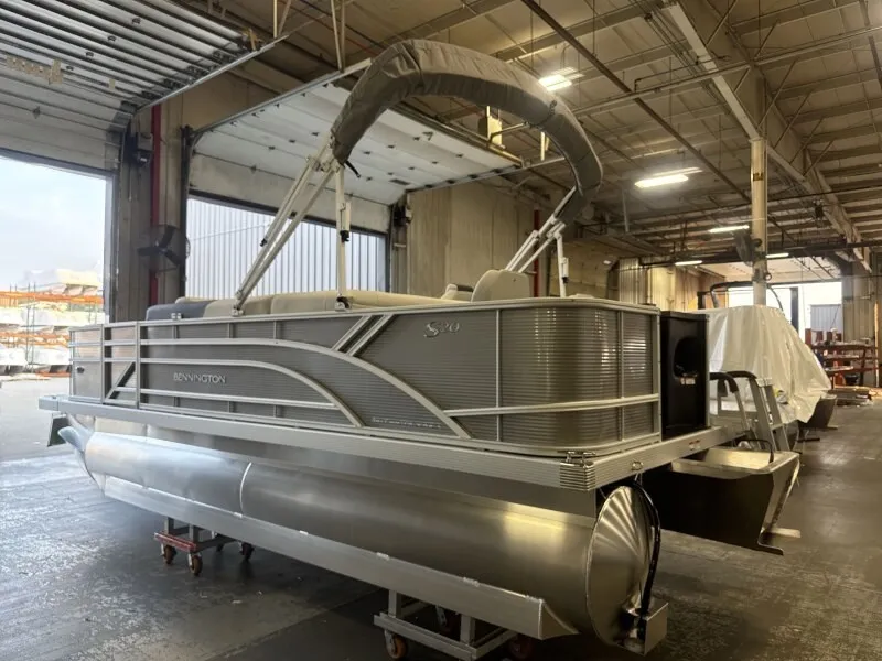 The Image of Bennington 20 S1 4 PT FISHING pontoon boat in a warehouse. - 1
