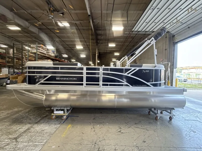 Slide: The Image of Bennington 20 S1 STERN RADIUS pontoon boat in a warehouse. - 3
