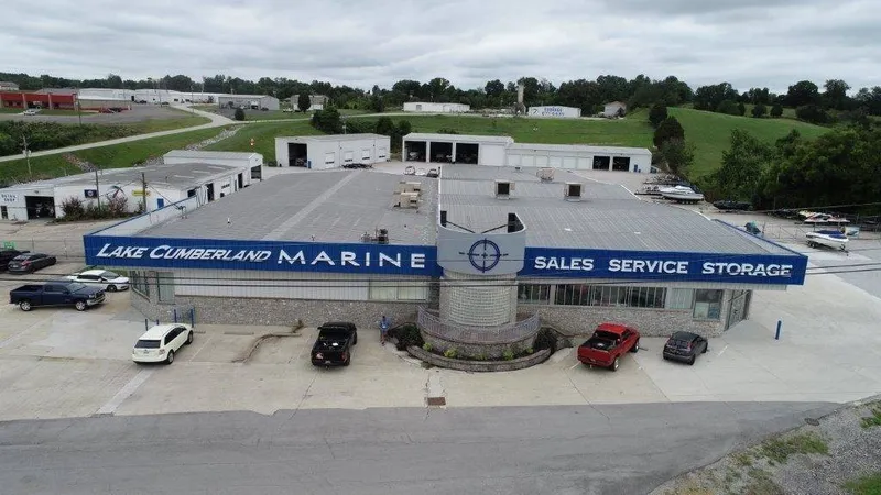 Slide: The Image of Aerial view of a large building labeled "Lake Cumberland Marine." Cars are visible in the parking lot. - 2