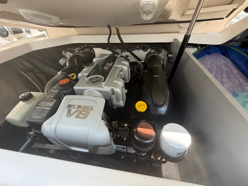 Slide: The Image of A powerful V8 engine is mounted inside a boat, surrounded by clean, white casing. - 15