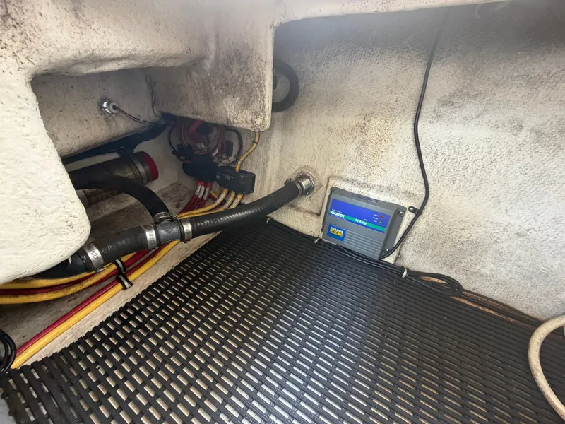 Slide: The Image of A technical area of a boat with hoses and an electronic device mounted on the wall. - 17