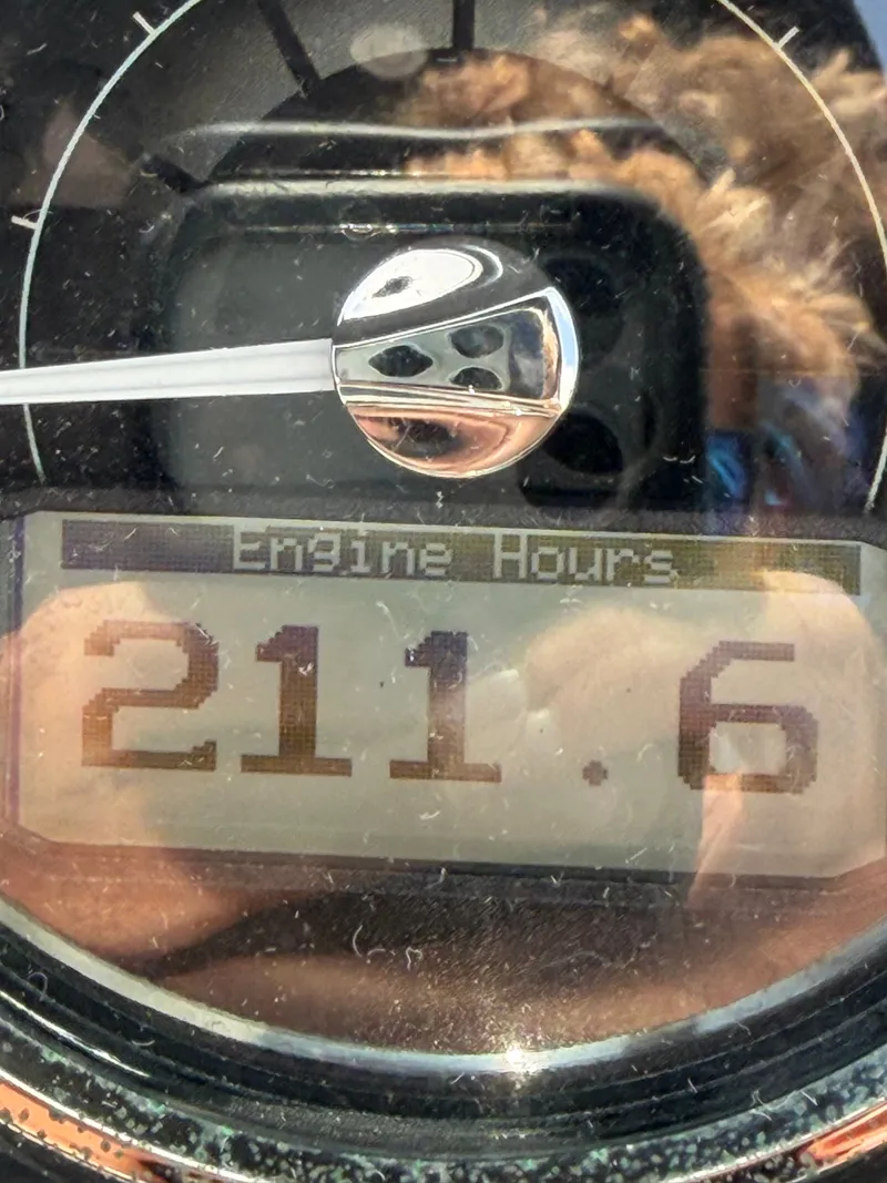 Slide: The Image of Close-up of a boat gauge displaying 211.6 engine hours. - 13