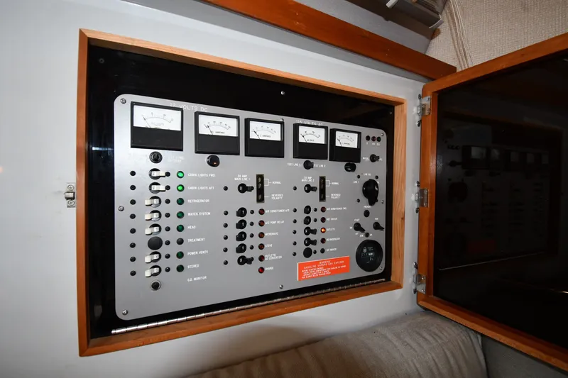 Slide: The Image of Electrical control panel on a 1989 Sea Ray 390 Express Cruiser boat. - 38