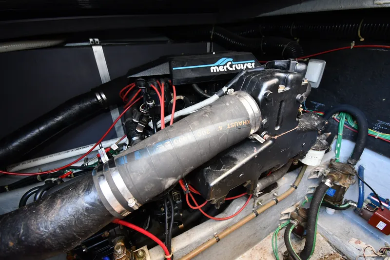 Slide: The Image of Engine compartment of 1989 Sea Ray 390 Express Cruiser with MerCruiser components. - 42