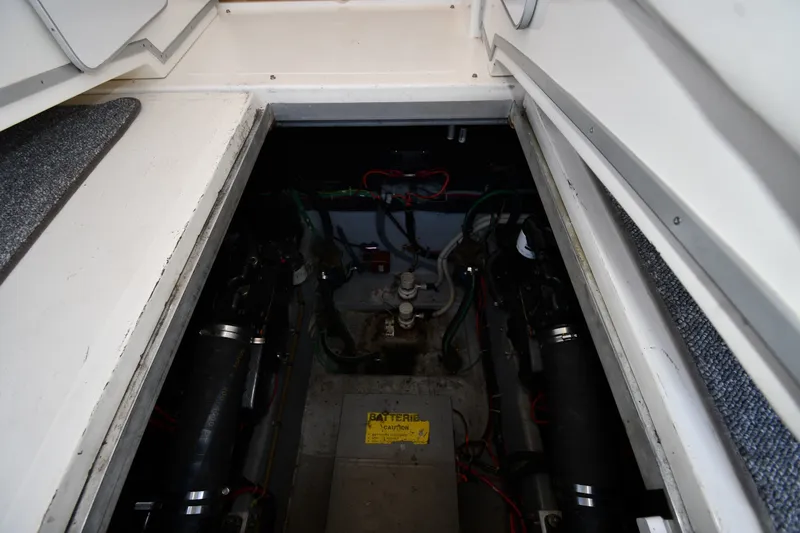 Slide: The Image of Engine compartment of 1989 Sea Ray 390 Express Cruiser, showcasing mechanical components and wiring. - 40