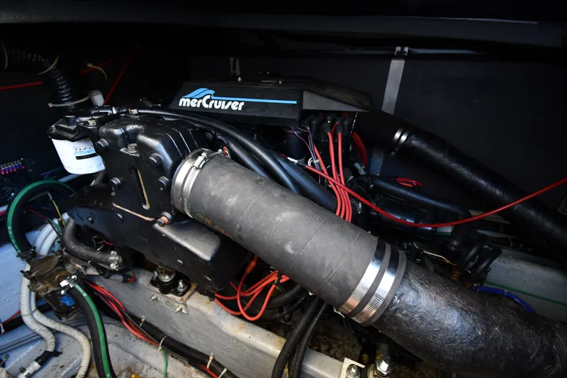 Slide: The Image of Engine compartment of 1989 Sea Ray 390 Express Cruiser with MerCruiser components. - 41