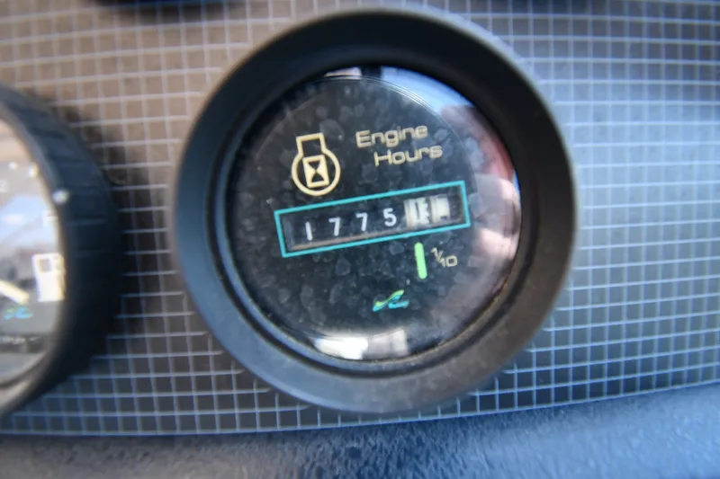 Slide: The Image of Close-up of engine hours gauge reading 1775 on 1989 Sea Ray 390 Express Cruiser. - 13