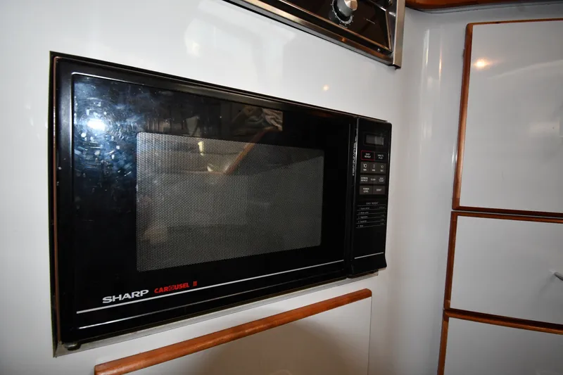 Slide: The Image of Sharp Carousel II microwave in 1989 Sea Ray 390 Express Cruiser kitchen. - 36