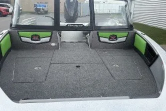 Slide: The Image of 2026 Ranger 1880MS boat interior with green accents and spacious deck. - 2