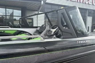 Slide: The Image of 2026 Ranger 1880MS boat with sleek design and modern features, parked outdoors. - 3
