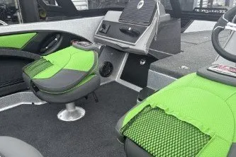 Slide: The Image of 2026 Ranger 1880MS boat interior with green seats and modern dashboard. - 5