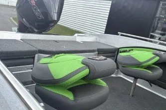 Slide: The Image of 2026 Ranger 1880MS boat interior with green seats and motor, showcasing modern design. - 7