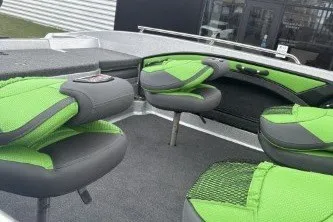 Slide: The Image of 2026 Ranger 1880MS boat interior with green and gray seating, showcasing modern design. - 4