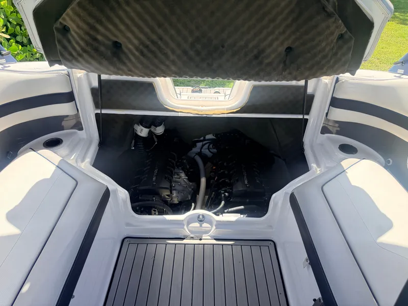 Slide: The Image of The engine compartment of a 2020 Yamaha 242SE with dual engines and cushioned covers. - 12