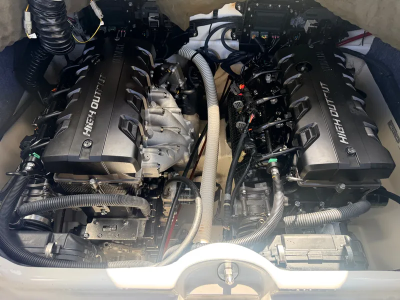 Slide: The Image of Engine compartment of a 2020 Yamaha 242SE boat with two powerful engines. - 13